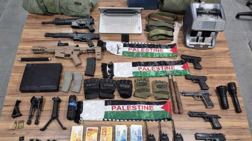 Terrorist funds, weapons and other combat equipment seized by Israelis security forces during a raid in the Palestinian village of Barta'a, Aug. 6, 2025. Credit: Israel Police.
