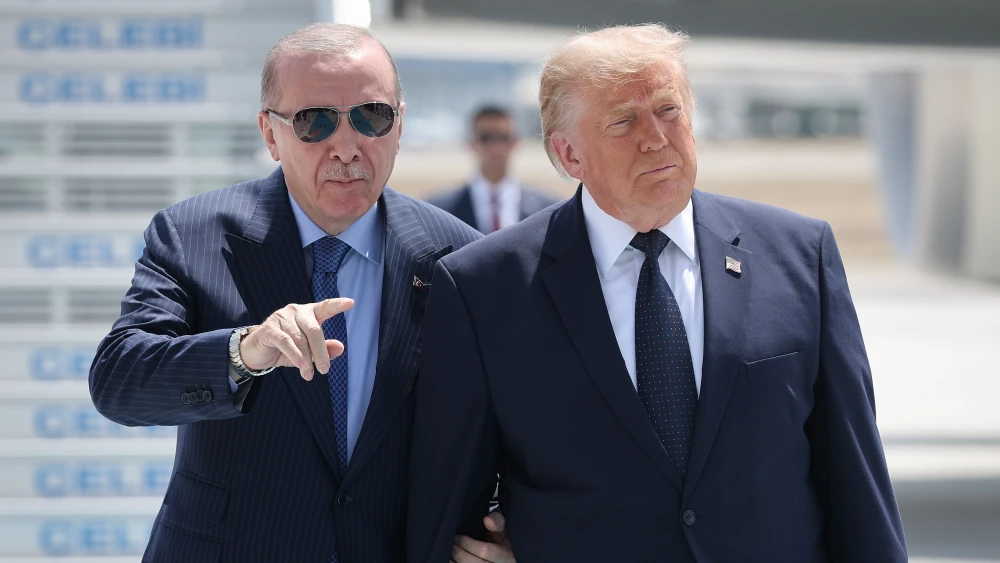 Turkish President Recep Tayyip Erdoğan escorts U.S. President Donald Trump as Trump arrives at Etimesgut Air Base for the annual NATO Summit in Ankara, Turkey, on July 7, 2026. Credit: Win McNamee/Getty Images.