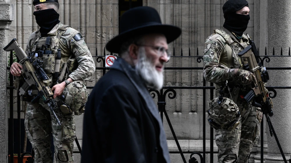 Belgian military personnel stand guard outside a synagogue in central Antwerp as part of Belgium's reinforced security measures established at Jewish schools and synagogues, March 23, 2026. Photo by John Thys/AFP via Getty Images.