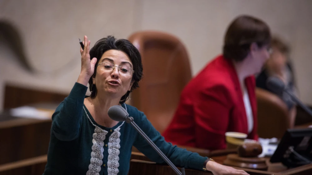 Knesset Member Hanin Zoabi speaks on the podium during a marathon plenary session in the Knesset regarding the "Recommendations Bill." Dec. 27, 2017. Photo by Hadas Parush/Flash90.