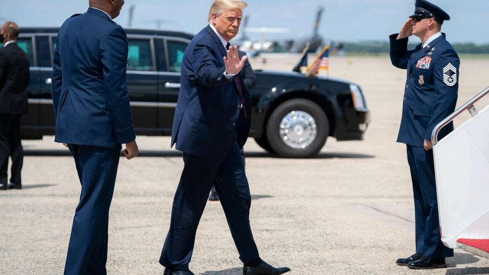 U.S. President Donald Trump waves as he prepares to board Air Force One at Joint Base Andrews, Md., Aug. 20, 2020, en route to Wilkes-Barre Scranton International Airport in Avoca, Pa. Credit: Tia Dufour/The White House.