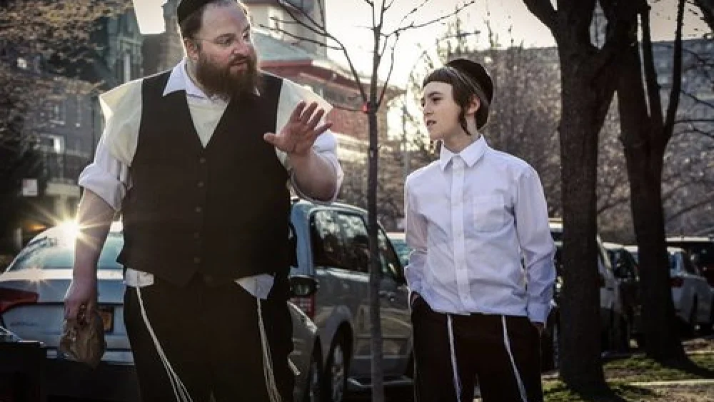 Chassidic father Menashe and his son, Rieven, in the film “Menashe.” Credit: Federica Valabrega.