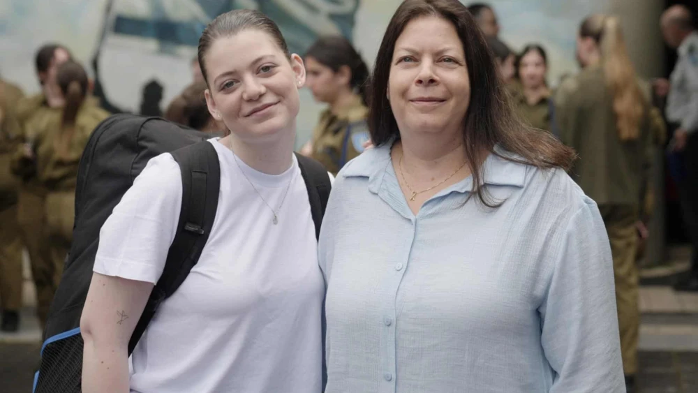 Former Gaza hostages Noga (left) and Shiri Weiss at an Israel Defense Forces recruitment center, May 6, 2024. Credit: IDF.