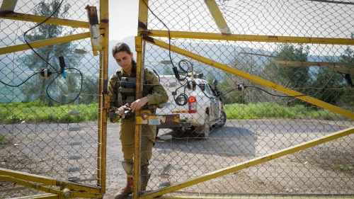 An Israeli soldier at the border fence on the tripoint frontier between Israel, Syria and Jordan, Feb. 15, 2024. Photo by Michael Giladi/Flash90.
