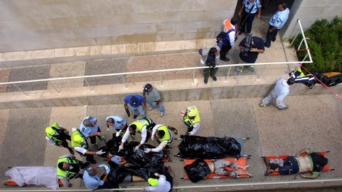 Bodies are taken away following an explosion at the cafeteria of Jerusalem's Hebrew University on July 31, 2002, during the years of the Second Intifada. Hamas took responsibility for the bombing, which killed seven people and wounded 70. Photo by Flash90.
