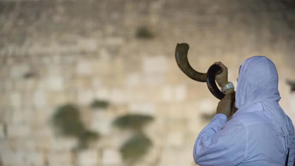 Blowing a shofar at the Western Wall in the Old City of Jerusalem, Sept. 16, 2017. Photo by Yonatan Sindel/Flash90.