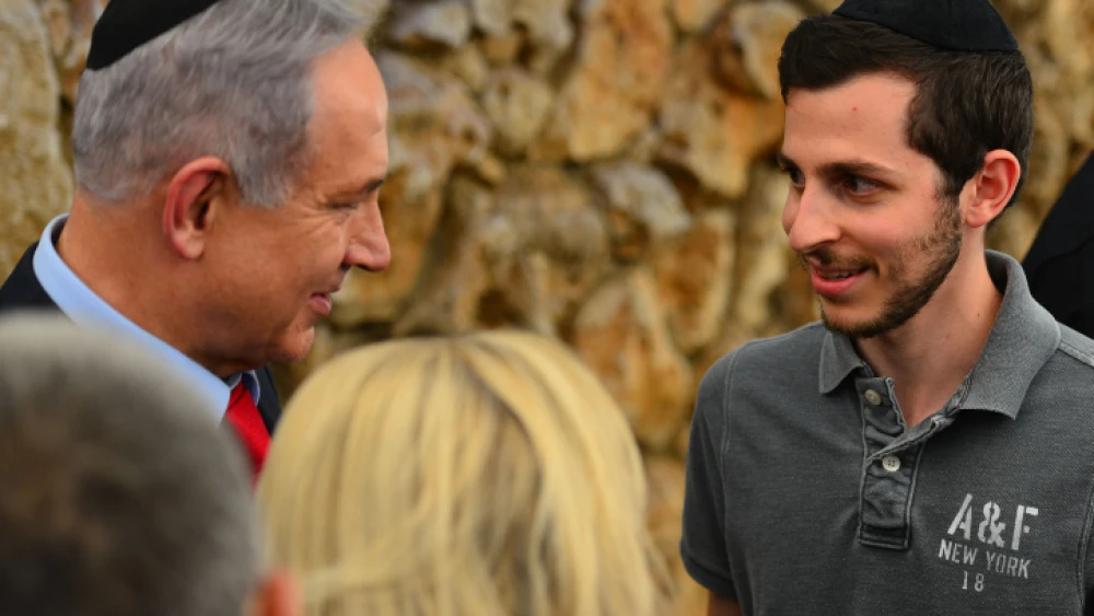 Israeli Prime Minister Benjamin Netanyahu speaks with former Hamas captive Gilad Shalit during a memorial ceremony for Netanyahu’s brother, Yoni Netanyahu, on the 40th anniversary of his death, at the Mount Herzl Military Cemetery in Jerusalem, July 12, 2016. Photo by Kobi Gideon/GPO.