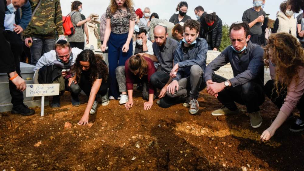 Family and friends attend the Dec. 22 funeral of Tal Menashe resident Esther Horgen, who was killed in a terrorist attack on Dec. 21, 2020. Photo by Meir Vaknin/Flash90.