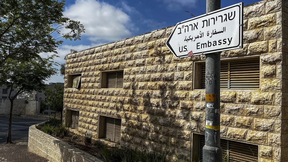 A road sign points toward the U.S. embassy in Jerusalem on April 19, 2024. Photo by Ronaldo Schemidt/AFP via Getty Images.