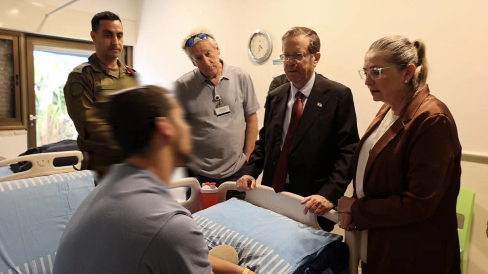Israeli President Isaac Herzog visits a wounded Israel Defense Forces soldier at Sheba Medical Center, outside Tel Aviv, May 11, 2026. Source: @Isaac_Herzog/X.