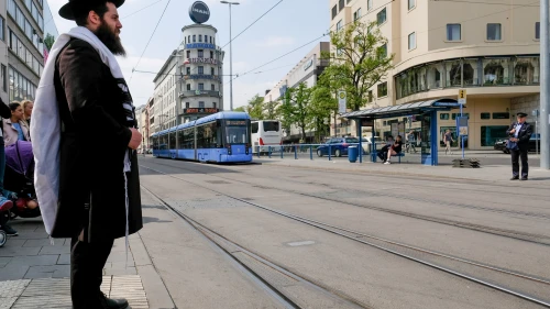 An observant Jewish man seen waiting on the streets in Munich, Germany. May 05, 2018. Credit: Nati Shohat/FLASH90