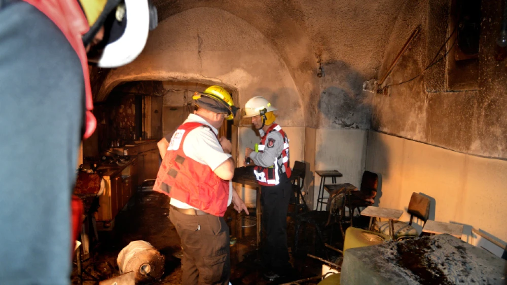 Firefighters at the site of an arson attack in the central Israeli town of Ramle. April 9, 2014. Photo by Yossi Zeliger/Flash90.