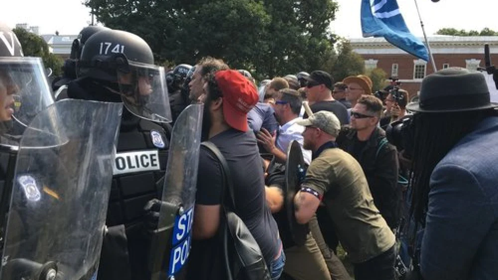 White-supremacist protesters clash with police in Charlottesville, Va., Aug. 12. Credit: Evan Nesterak via Wikimedia Commons.