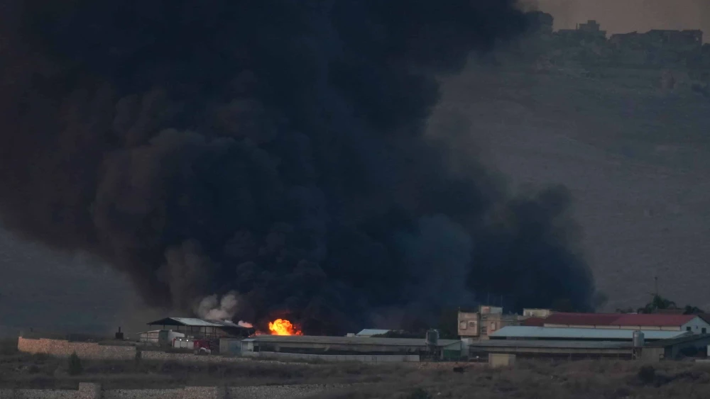 Smoke rises from a large fire after missiles launched from Lebanon hit Moshav Avivim, near the Israeli border with Lebanon, Nov. 6, 2024. Photo by Ayal Margolin/Flash90.