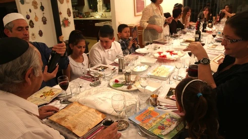 A family seen during the Passover seder on the first night of the holiday in Tzur Hadassah, Israel, on March 25, 2013. Diaspora Jews observe two seders each year, as opposed to one seder per year in Israel. Credit: Nati Shohat/Flash90.
