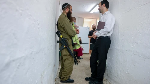 Ultra-Orthodox Jews pray inside a public shelter in northern Israel during alarms and rocket and missile fire from Iran into Israel. June 16, 2025. Photo by David Cohen/FLASH90.