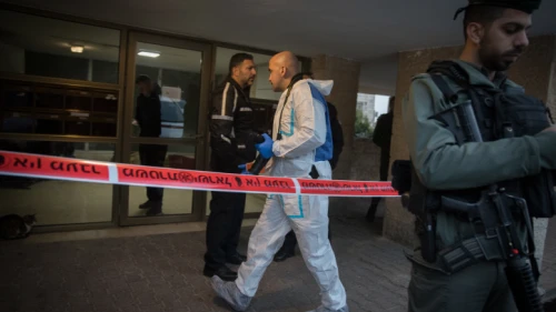 Israeli forces seen outside the building where two people was found dead at an apartment in the at Armon Hanatziv neighborhood in Jerusalem, on Jan. 13, 2019. Photo by Noam Revkin Fenton/Flash90.