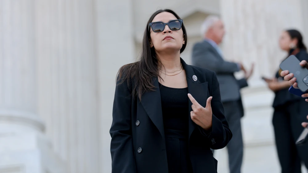 Rep. Alexandria Ocasio-Cortez (D-N.Y.) speaks to reporters on the House steps after a series of votes at the U.S. Capitol in Washington on July 22, 2026. Photo by Anna Moneymaker/Getty Images.