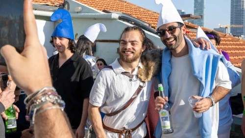 People dressed in costume pose for photos
