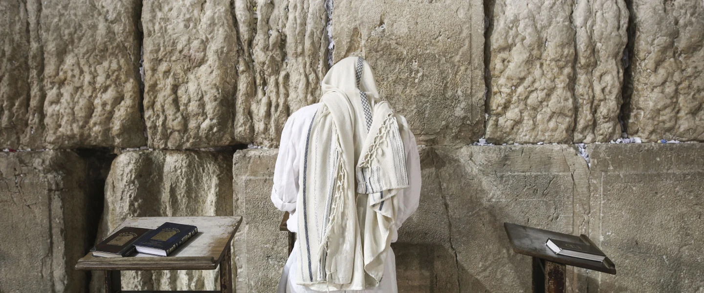 A Jewish worshipper at the Western Wall in the Old City of Jerusalem at the end of Yom Kippur, the Day of Atonement, and the holiest of Jewish holidays. Israel comes to a standstill for 25 hours during the holiday, when Jews traditionally fast and Israelis are prohibited from driving. Photo by Flash90.
