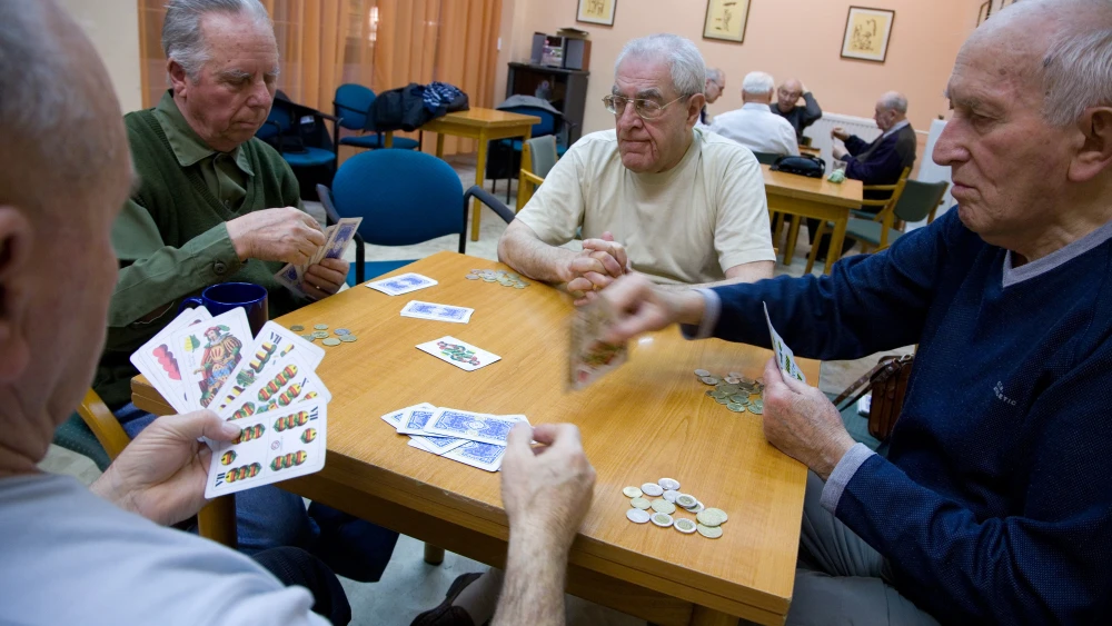 Elderly men play a typical Hungarian card game called “ulti” at the Balint House in Budapest, Hungary. Credit: JDC.