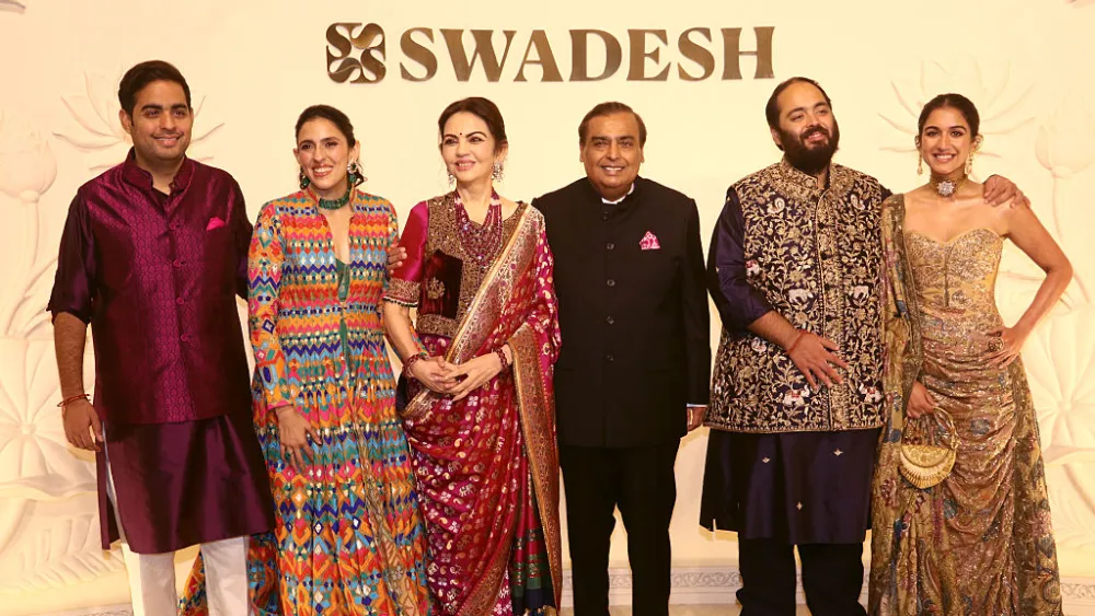 Akash Ambani, Shloka Mehta, Nita Ambani, Mukesh Ambani, Anant Ambani and Radhika Merchant attend the "Devi Shakti" Celebration on Oct. 10, 2026 in Mumbai. Photo by Prodip Guha/Getty Images.