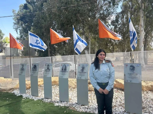 War Room commander Capt. Gaya Shimsilshvili at the IDF Home Front Command’s Urim base, standing by the remembrance corner for soldiers killed on Oct. 7, 2023. Photo by Amelie Botbol.