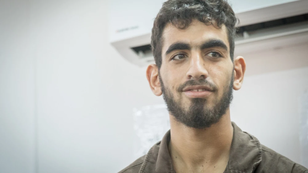 Omar al-Abed is brought to the courtroom for his trial at Israel's Ofer military court near Ramallah, on Aug. 17, 2017. Photo by Yonatan Sindel/Flash90.