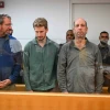 Four men, including Rear Adm. (res.) Ofer Doron (left), accused of firing flares at Prime Minister Benjamin Netanyahu's private residence in Caesarea, arrive for a hearing at the Haifa District Court on Dec. 2, 2024. Credit: Flash90.