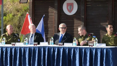 Israeli Prime Minister Benjamin Netanyahu, Defense Minister Yoav Gallant (second from left) and Israel Defense Forces Deputy Chief of Staff Maj. Gen. Amir Baram (second from right) hold a Passover toast with the canine unit and counterterrorism soldiers at the Adam Base on April 3, 2023. Credit: Amos Ben-Gershom/GPO.