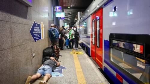 Israelis take cover inside a bomb shelter at the Ben Gurion airport as a siren alert is sounded in Tel Aviv, Oct. 1, 2024. Photo by Dor Pazuelo/Flash90.