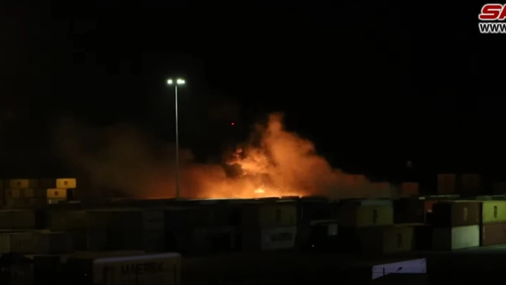 Shipping containers burn at Syria's Latakia port following what Syrian media claim was an Israeli missile strike, Dec. 7, 2021. Source: Screenshot.