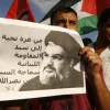 A Palestinian protester from the Popular Front for the Liberation of Palestine (PFLP) holds a picture Hezbollah leader Sheikh Hassan Nasrallah during a demonstration in Rafah, in the southern Gaza Strip, on Sept. 3, 2014. Credit: Abed Rahim Khatib/Flash90.