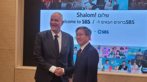 Rafi Harpaz, left, meets an interlocutor at an Israeli embassy event in Seoul, South Korea on March 26, 2025. Photo credit: Courtesy of the Israeli embassy in Seoul.