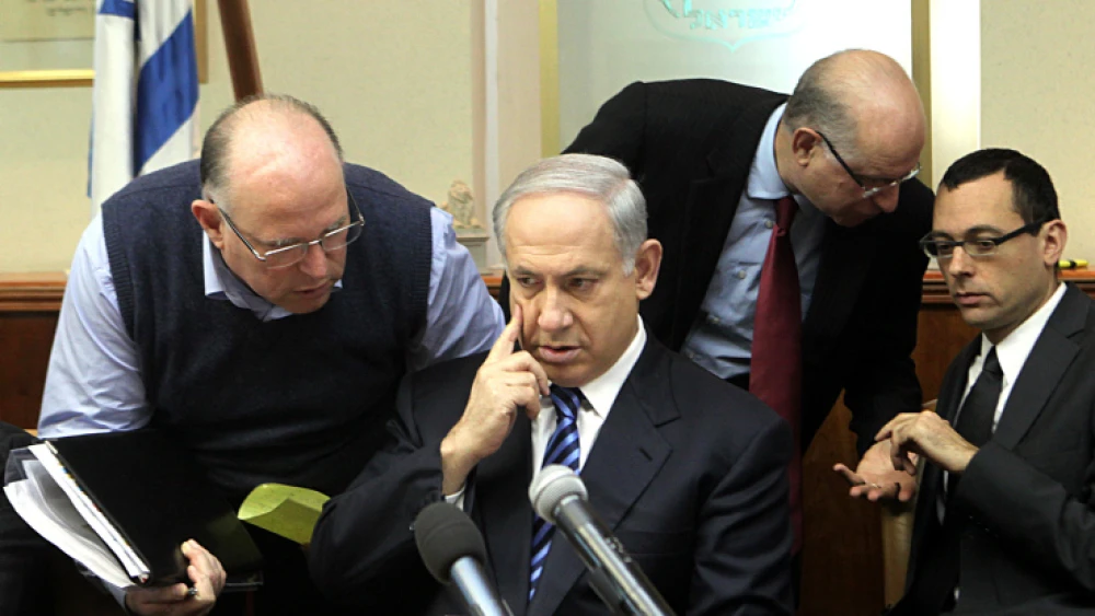Israeli Prime Minister Benjamin Netanyahu listens to National Security Adviser Uzi Arad (L), at the weekly cabinet meeting, held in the Prime Minister's Office in Jerusalem, on Sunday, Dec. 27, 2009. Photo by Kobi Gideon /Flash90.