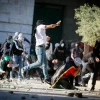 Palestinian rioters hurl stones towards Israeli security forces during Ramadan clashes on the Temple Mount in Jerusalem's Old City, April 15, 2022. Photo by Jamal Awad/Flash90.