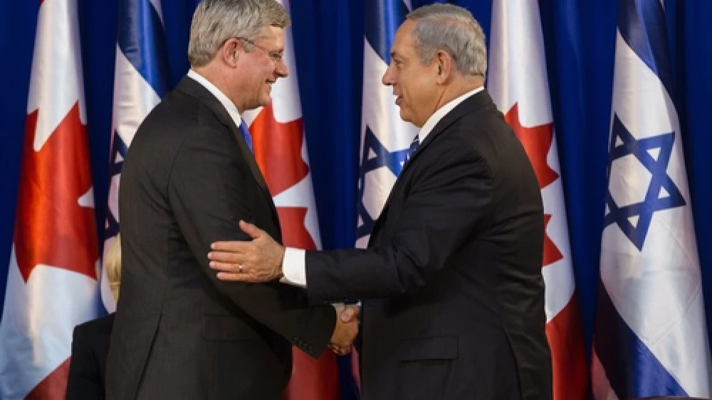Israeli Prime Minister Benjamin Netanyahu shakes hands with Canadian Prime Minister Stephen Harper during a welcoming ceremony for Harper at Netanyahu's office in Jerusalem on Jan.19, 2014. Photo by Flash90.