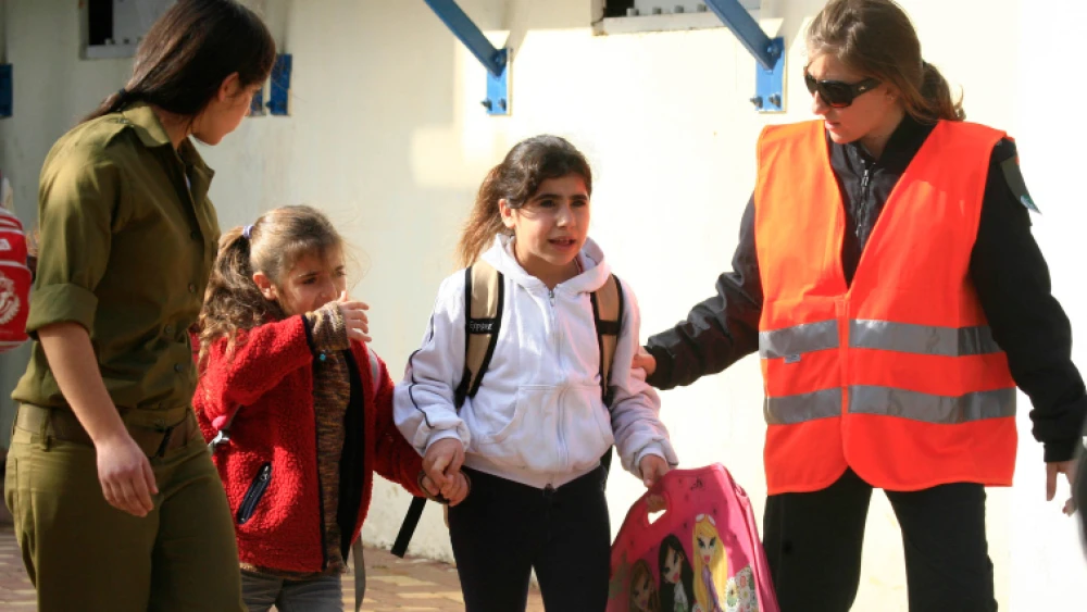 Students rush out of a school after a Qassam rocket hit the building in Sderot. All children were evacuated and some had to be treated for minor injuries and shock. Photo by Nati Shohat/Flash90.
