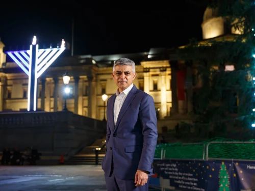 London Mayor Sadiq Khan poses next to a Chanukah menorah in Trafalgar Square on Dec. 11, 2020. Photo courtesy of Chabad-Lubavitch.