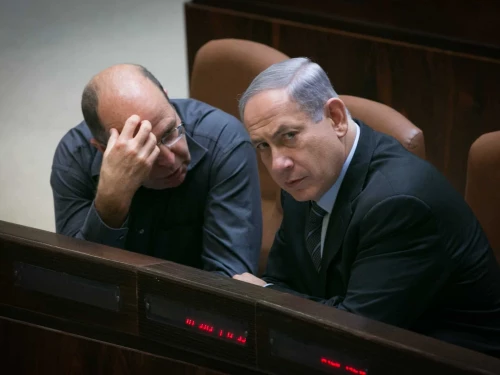 Israeli Prime Minister Benjamin Netanyahu speaks with Defense Minister Moshe Ya'alon in the plenary hall of the Knesset, the Israeli parliament in Jerusalem, May 11, 2015. Photo by Miriam Alster/Flash90.