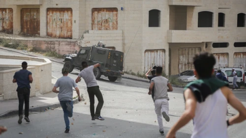 Palestinians clash with Israeli security forces during a raid of the Israeli army in the West Bank village of al-Am’ari near Ramallah on May 28, 2018. Photo by Flash90.