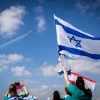 Hadassah Ein Kerem Medical team cheer an Israeli air force acrobatic team flies over Hadassah Ein Kerem hospital in Jerusalem on Israel's 72nd Inependence Day on April 29, 2020, Photo by Yonatan Sindel/Flash90.