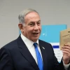 Likud Party Chairman Benjamin Netanyahu, then leader of the opposition, prepares to cast his vote in the Likud primary at a polling station in Tel Aviv on Aug. 10, 2022. Photo by Tomer Neuberg/Flash90.