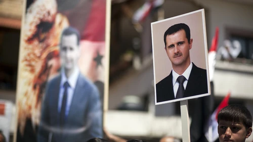 On April 17, 2012, Druze residents of Israel's Golan Heights hold Syrian flags and portraits of Syrian President Bashar Assad during a rally in the Druze village of Majdal Shams to mark the Syrian Independence Day. Credit: Matanya Tausig/Flash90.