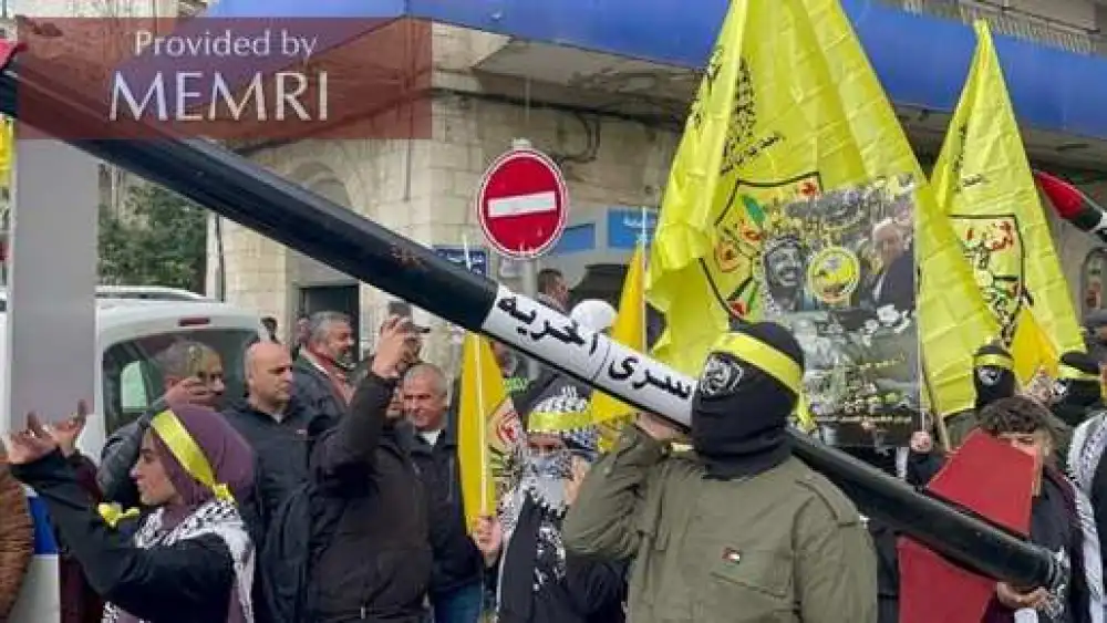 A Palestinian militant carries a rocket with the words “Prisoners of Freedom” on it during mass rallies on Dec. 30 and Dec. 31, 2021. Source: Facebook via MEMRI.