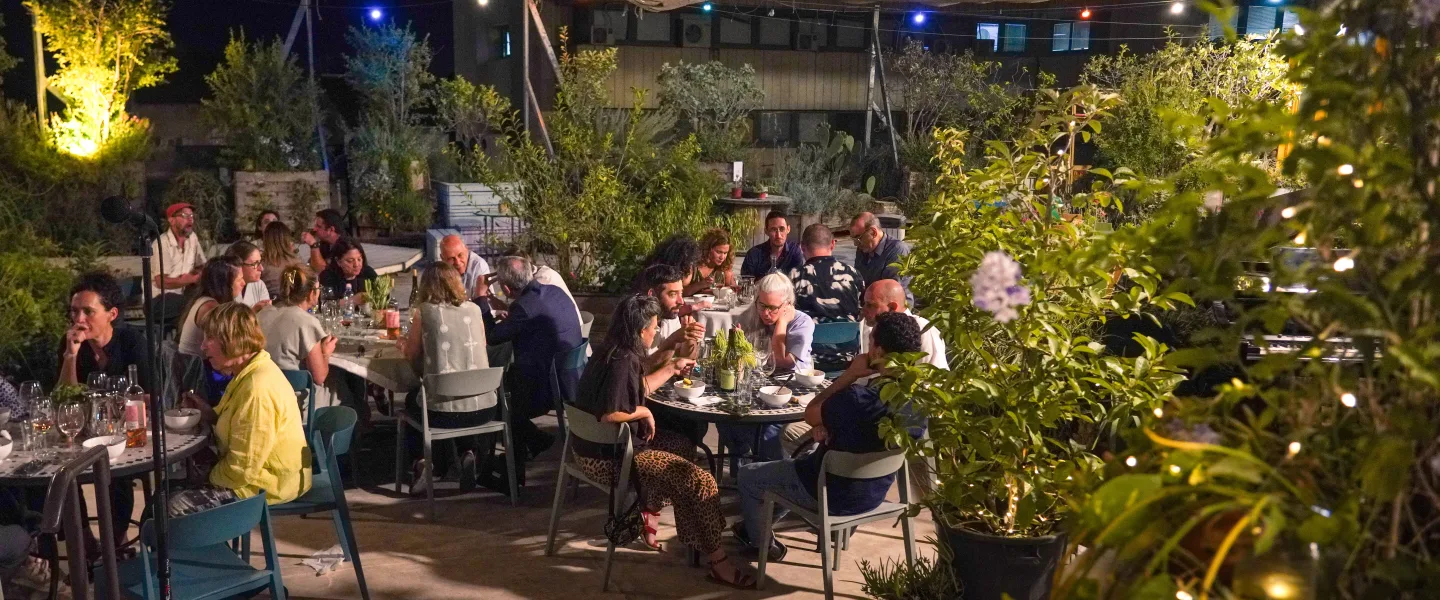 A view of the Agalala social coffee-cart cafe on the rooftop of Jerusalem’s Clal Center during a fundraising and appreciation dinner marking the project’s first six months, July 20, 2026. Photo by Liam Forberg.
