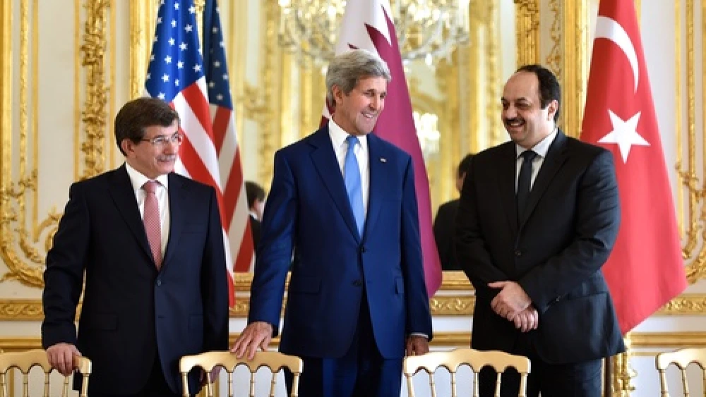 On July 26, 2014, (from left to right) Turkish Foreign Minister Ahmet Davutoğlu, U.S. Secretary of State John Kerry, and Qatari Foreign Minister Khalid bin Mohammad Al Attiyah hold a trilateral meeting in Paris focused on reaching a cease-fire deal for the Gaza conflict. JNS.org columnist Ben Cohen asks: Should we continue ignoring Qatari and Turkish backing of Hamas for the sake of a successful campaign against Islamic State? Credit: State Department.