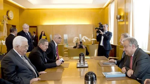Palestinian Authority leader Mahmoud Abbas (in front, at left) sits across the table from U.N. Secretary-General António Guterres in Geneva on Feb. 27, 2017. Credit: U.N. Photo/Jean-Marc Ferré.