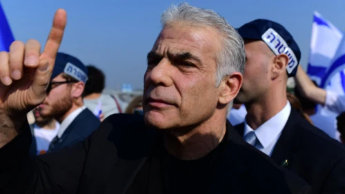 Outgoing Israeli Prime Minister Yair Lapid and Yesh Atid Party activists protest in Tel Aviv against Benjamin Netanyahu's incoming government, Dec. 9, 2022. Photo by Tomer Neuberg/Flash90.