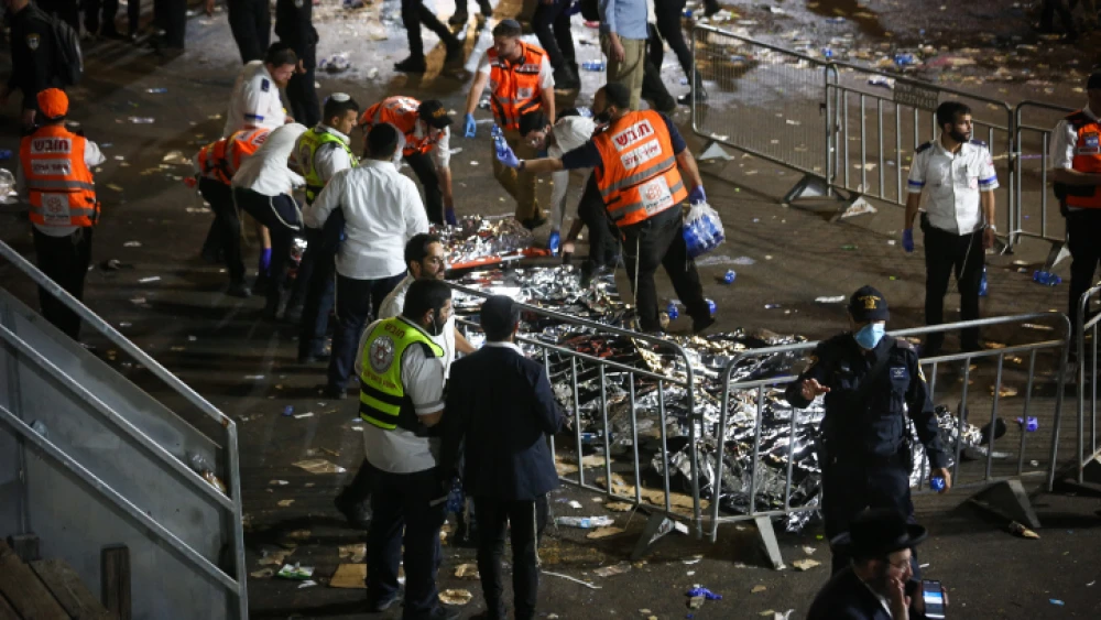 Israeli rescue service people and police near the scene of the deadly stampede at Mount Meron on Lag B'Omer, April 30, 2021. Photo by David Cohen/Flash90.